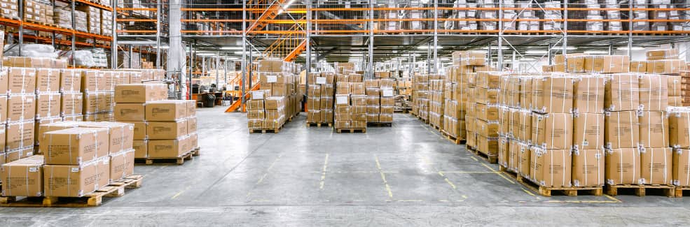 An industrial warehouse floor filled with palets